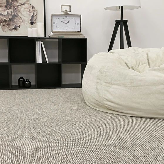 Minimalist bedroom with grey carpet